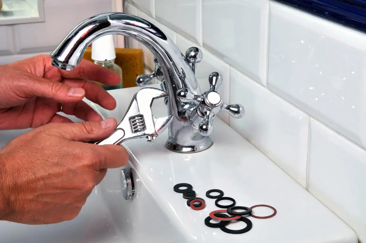 Plumber maintaining a bathroom faucet in Dana Point