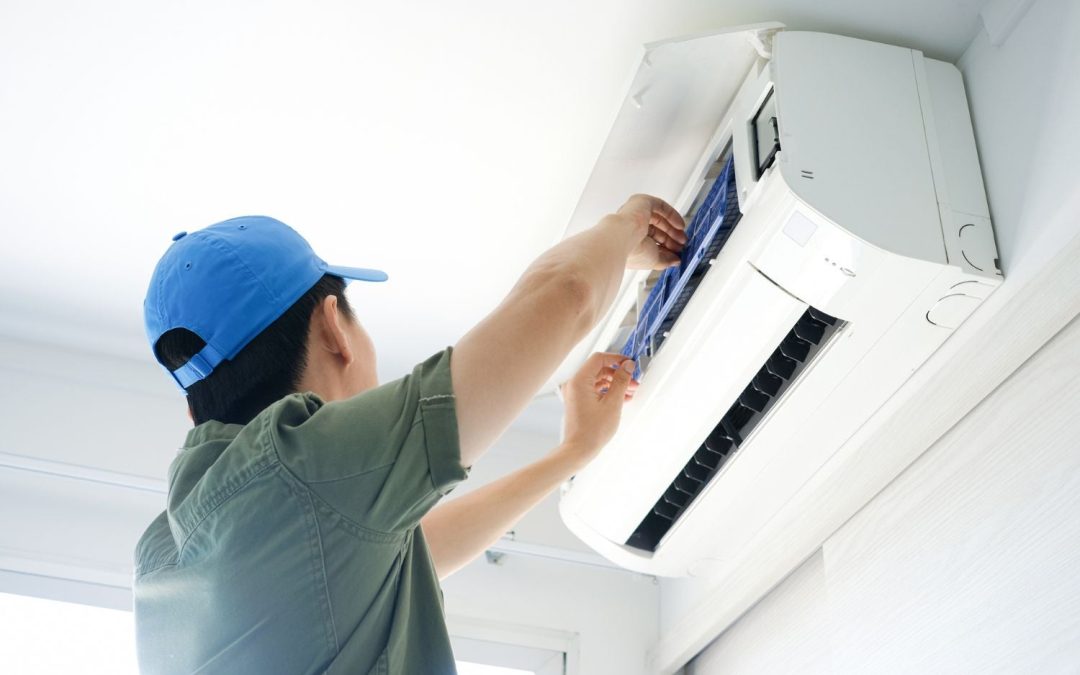 HVAC technician servicing a ductless mini split in Dana Point