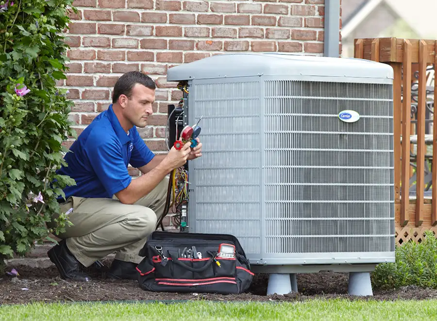 HVAC technician inspecting an outdoor AC unit in Dana Point