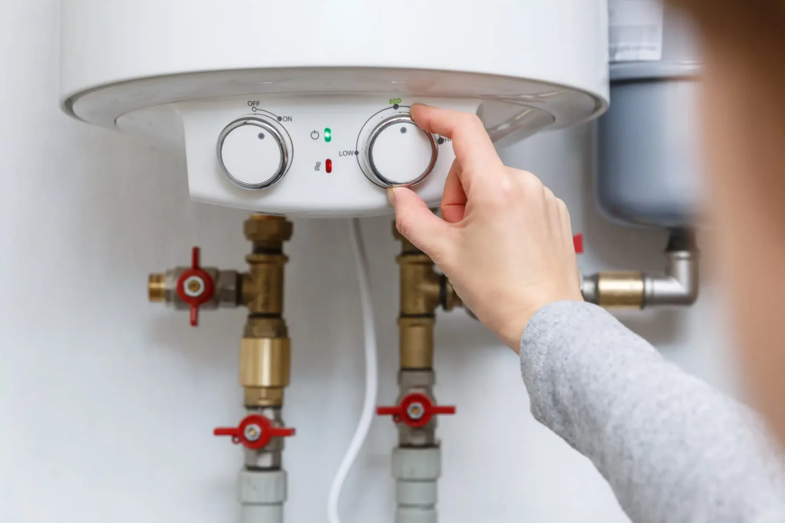 Technician adjusting a water heater in Dana Point